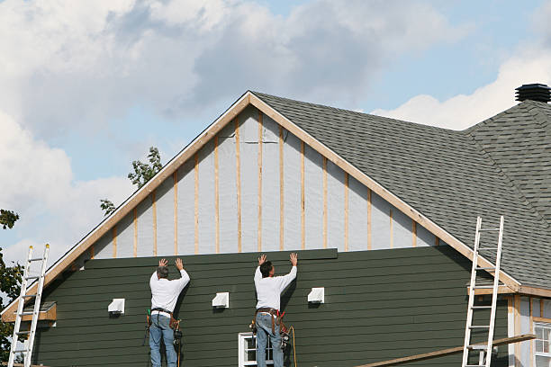 Professional Storm Damage Siding Repair technician working in Dornsife, PA